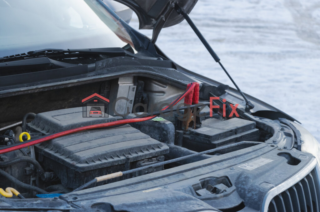 The hood of a car with a battery in it.