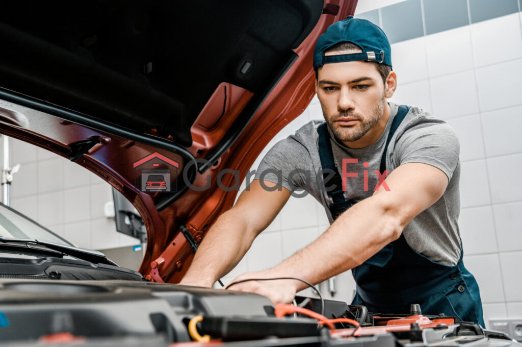 A mechanic working on the engine of a car.