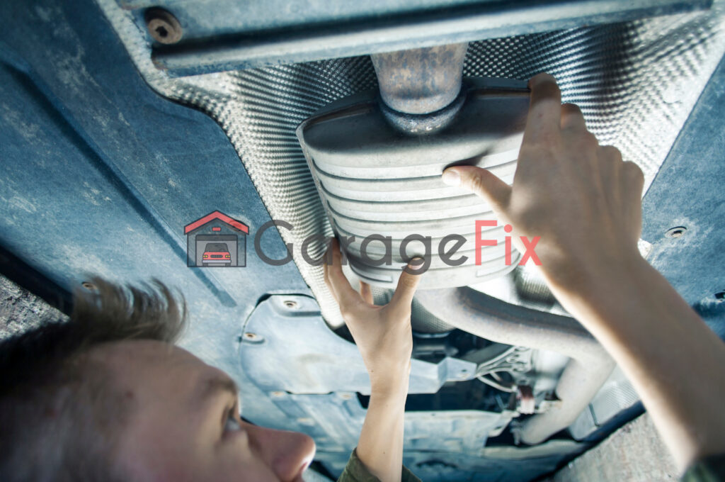 A man is working on a car under the hood.