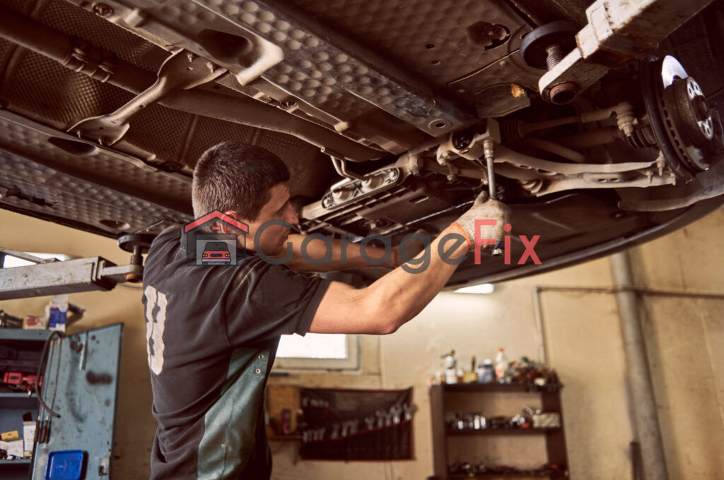 A mechanic working on a car in a garage.