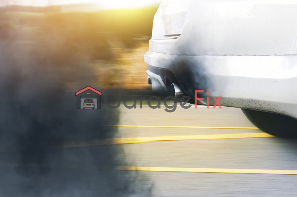 A white car with smoke coming out of its exhaust.