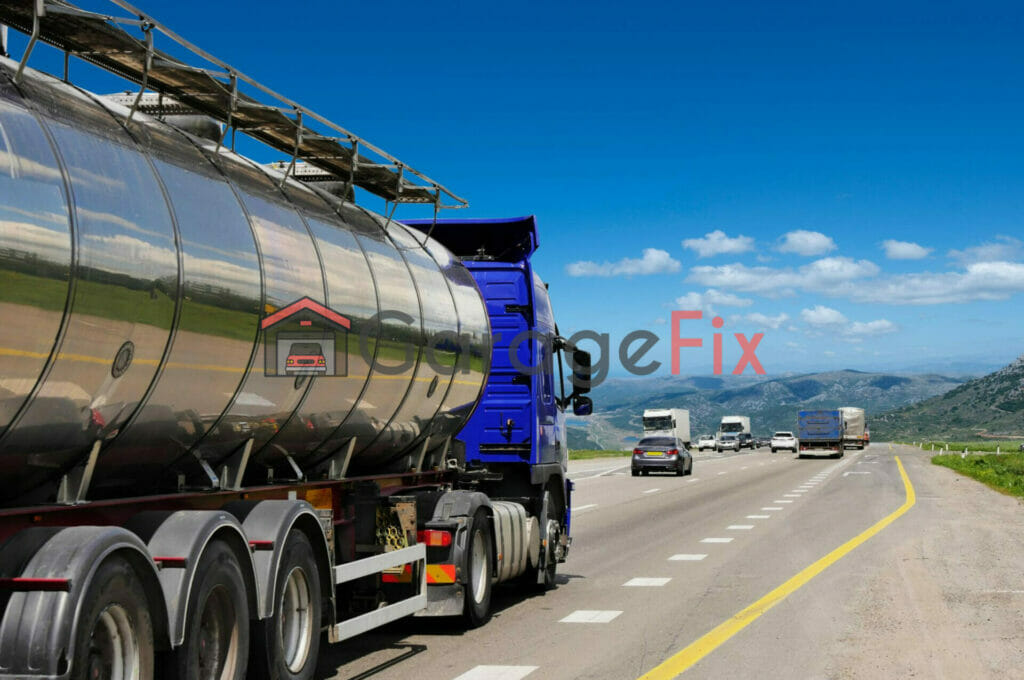 A large tank truck driving down the road.