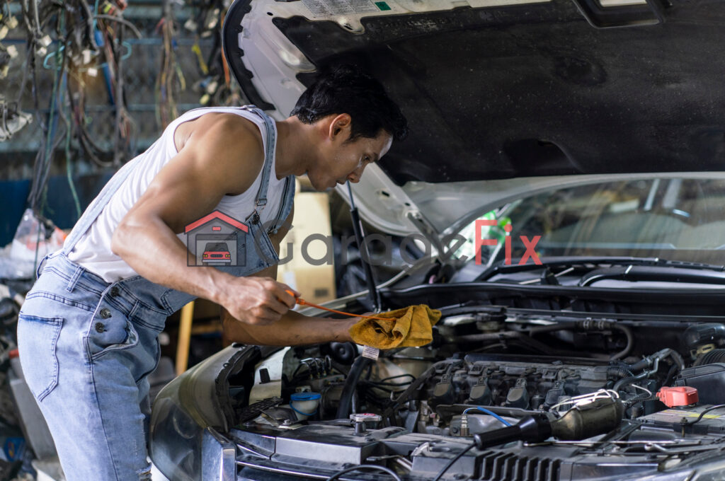 A mechanic working on a car in a garage.