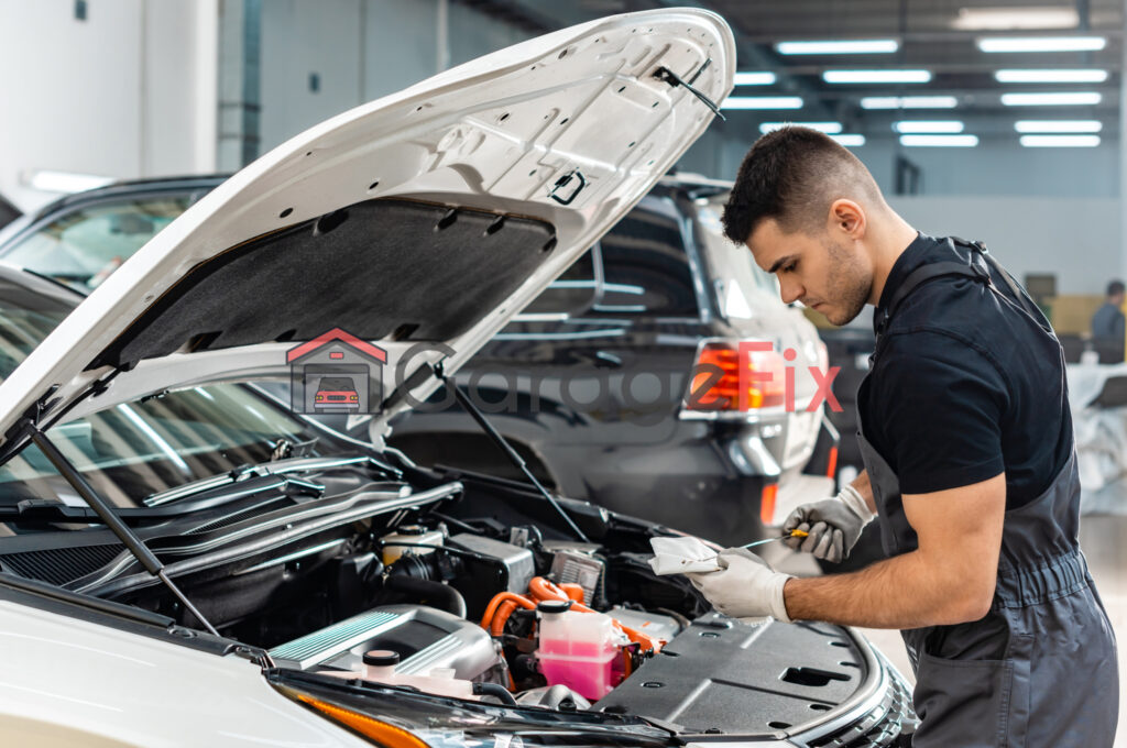 A mechanic working on a car in a garage.