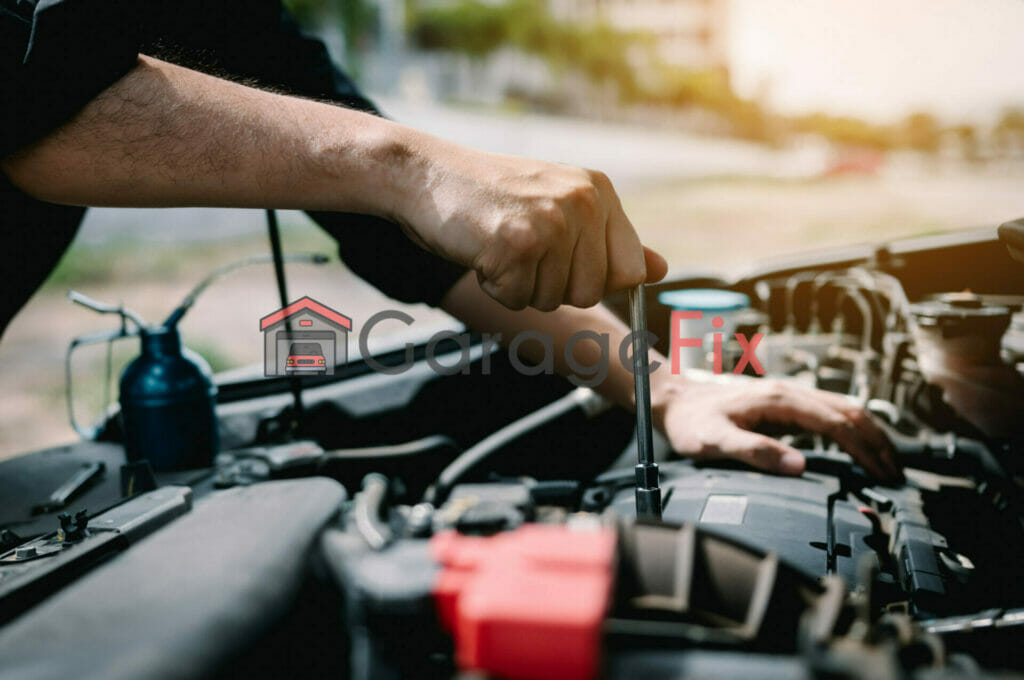 A mechanic working on the engine of a car.