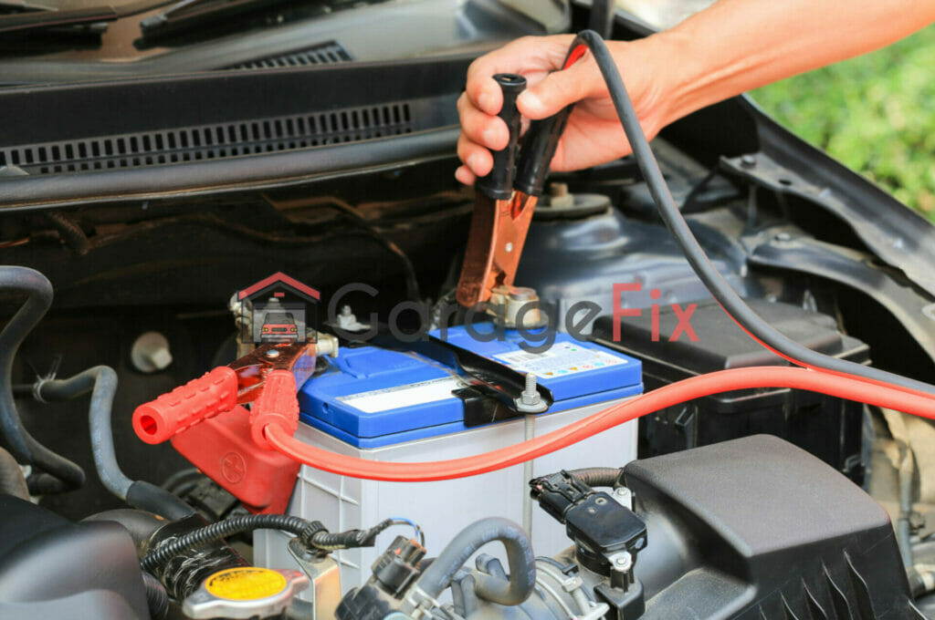 A man is working on a car battery.