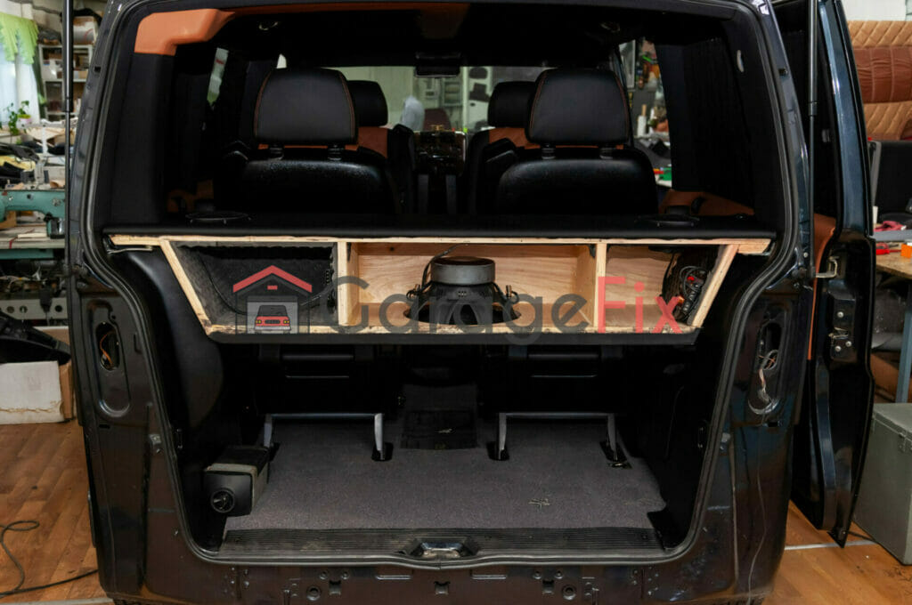 The back of a van with a storage compartment.