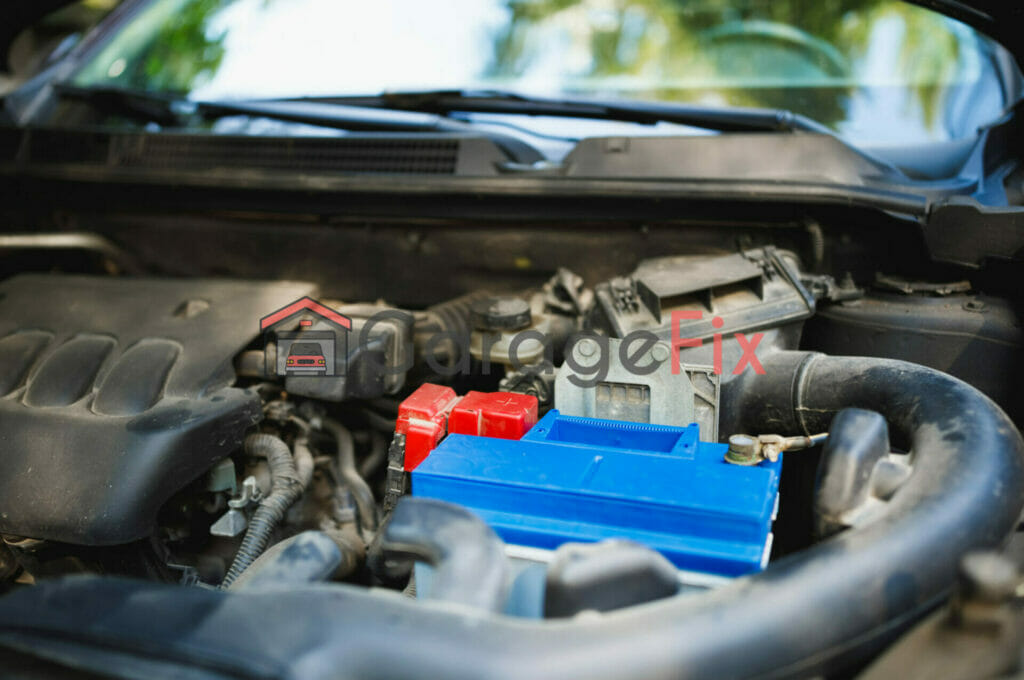 A car engine with a blue battery in the hood.