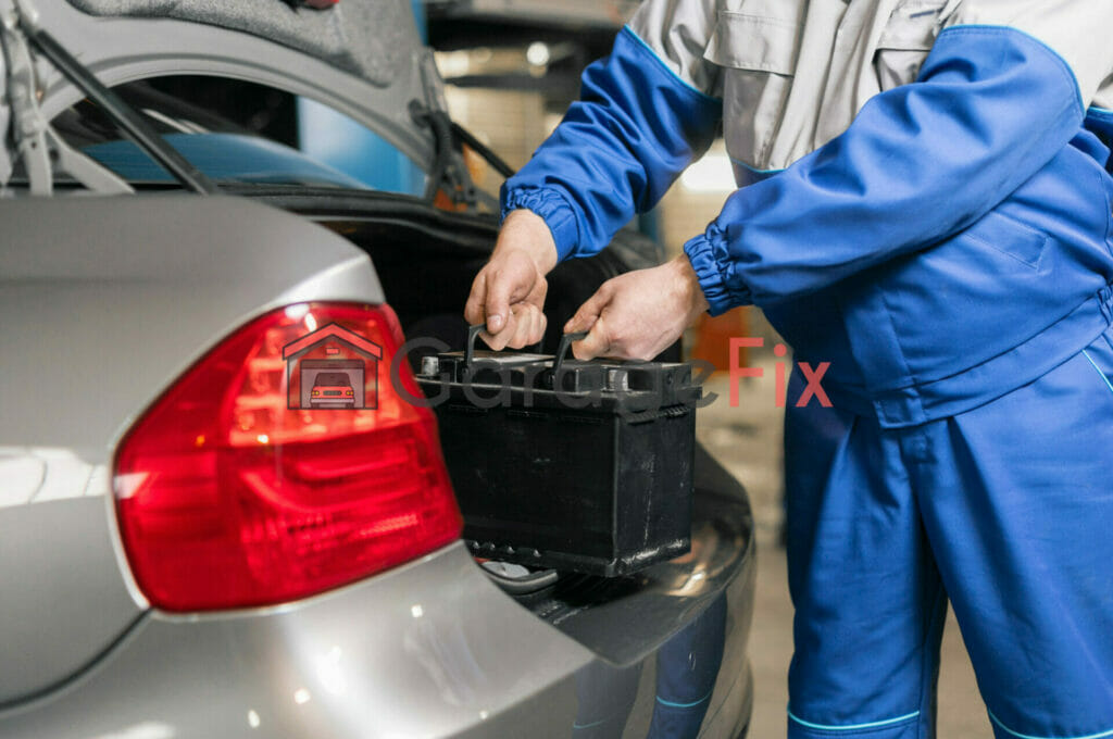 A mechanic opening the trunk of a car.