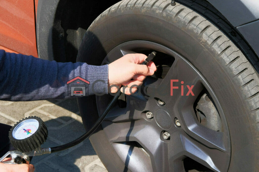 A man using a tire pressure gauge to fix a tire.