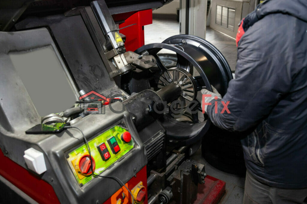 A man working on a machine in a garage.